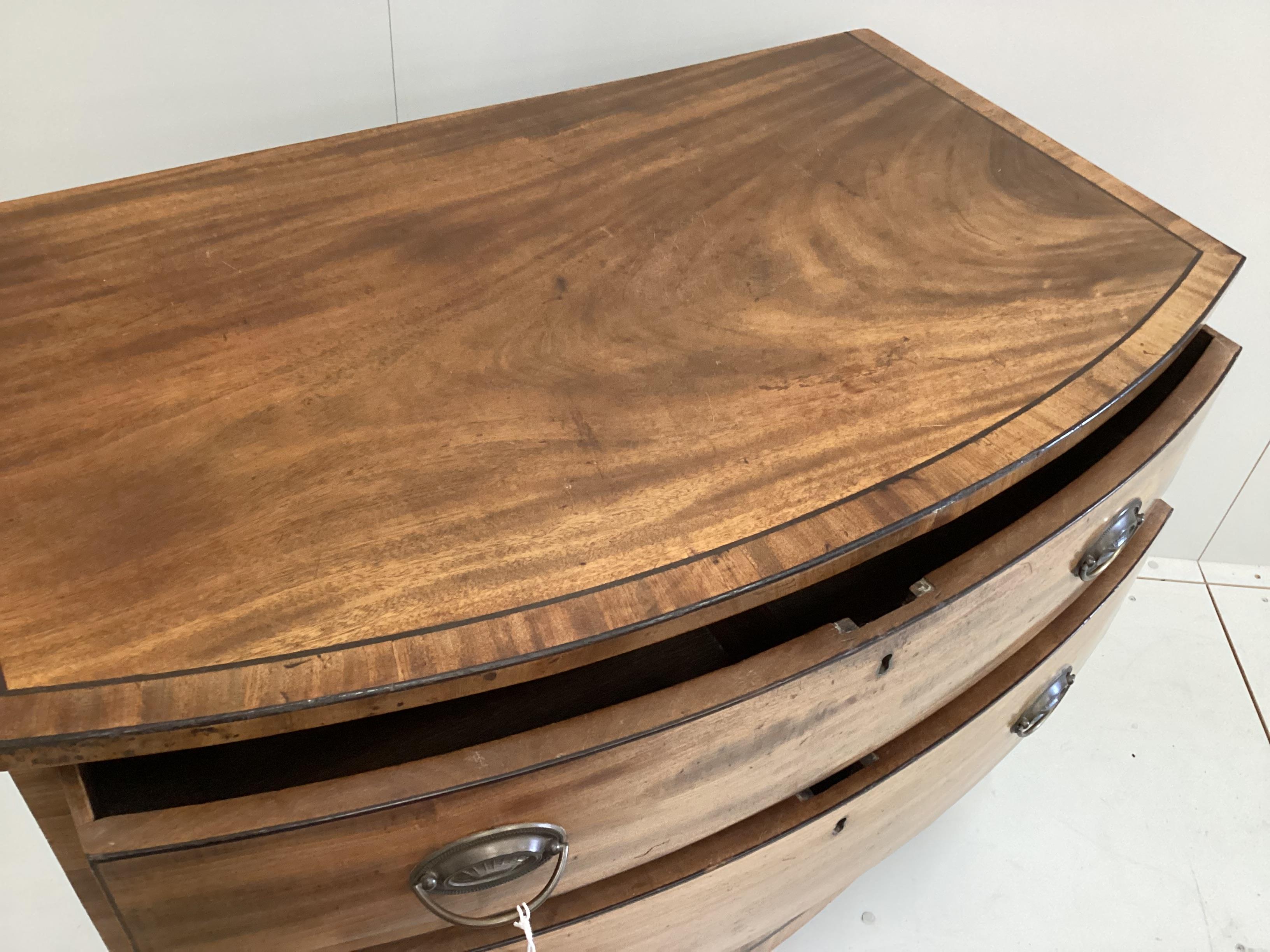 A small Regency banded mahogany bowfront three drawer chest, width 95cm, depth 57cm, height 80cm